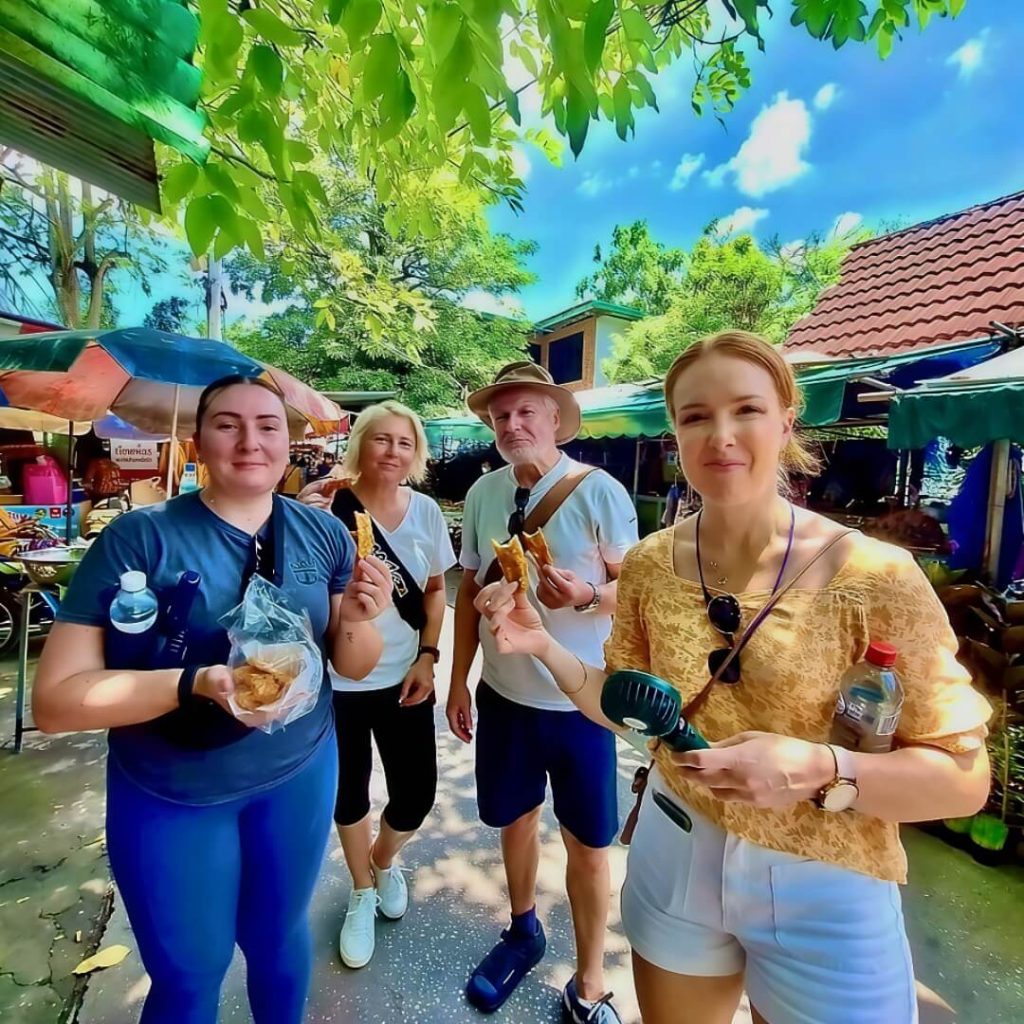 Guests enjoying local snacks during a break in Bang Krachao 