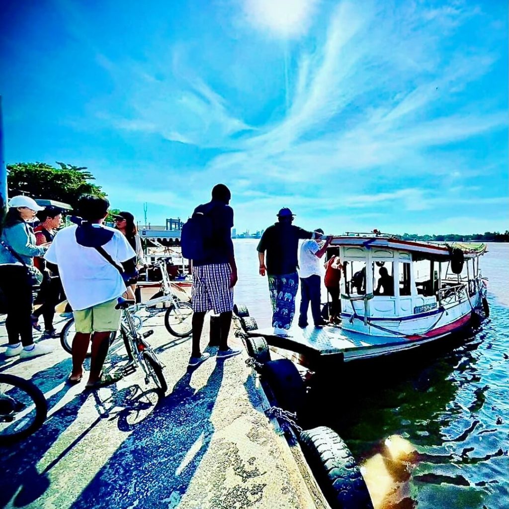 Guests boarding a local river boat to Bang Krachao on the Chao Phraya River