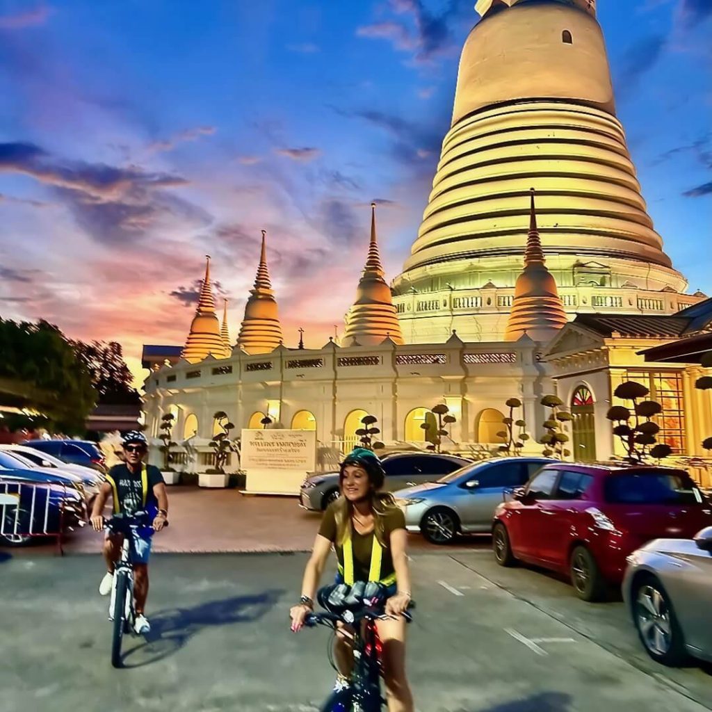 Cyclists riding through the grounds of Wat Prayoon in Bangkok