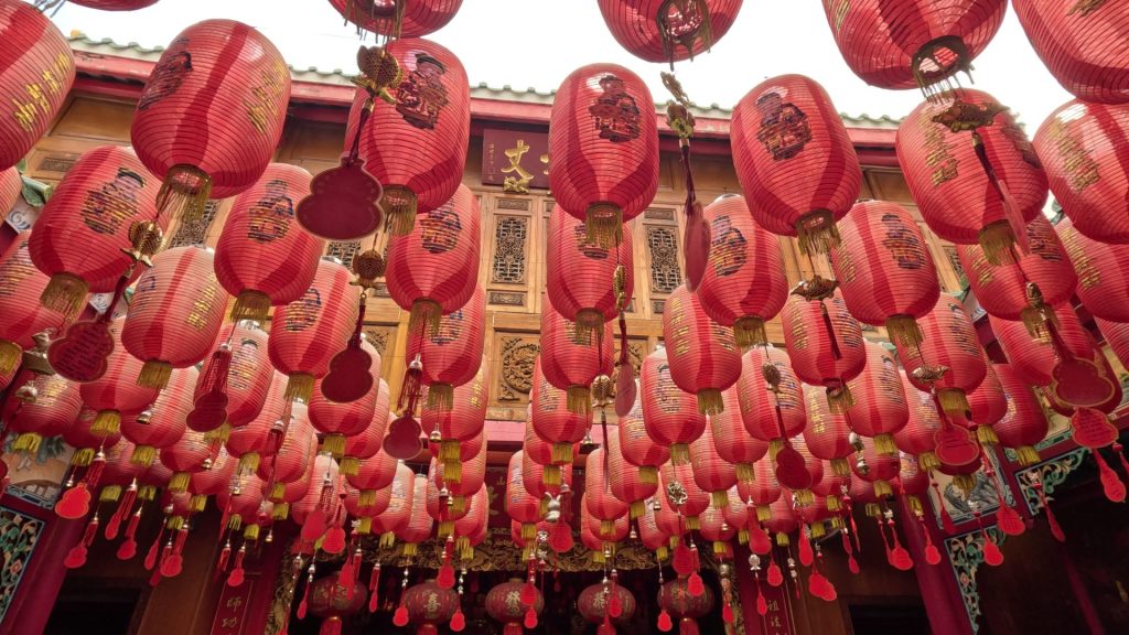 Red lanterns in the external courtyard at the Hidden Dragon temple, Chinatown, Bangkok