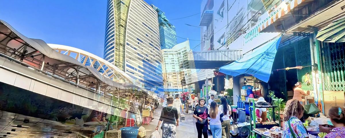 Cycling from Chong Nonsi Skywalk to Saint Louis BTS showing elevated skywalk and busy market street in Bangkok