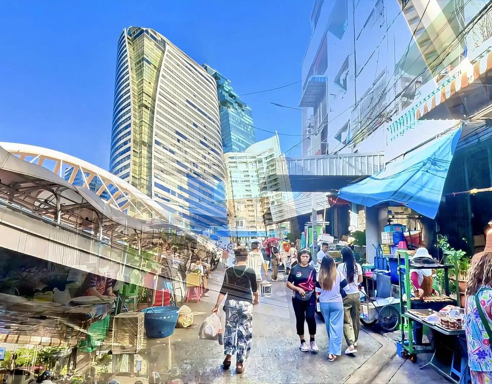 Cycling from Chong Nonsi Skywalk to Saint Louis BTS showing elevated skywalk and busy market street in Bangkok