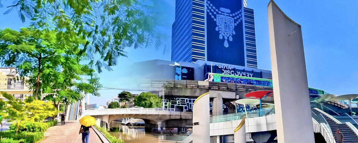 Cycling from Hua Lamphong to Siam Center showing canal path and stairs up to MBK walkway with BTS train in Bangkok