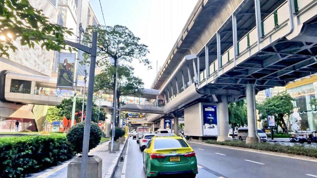Cycling along Phloen Chit Road past Central Embassy in Bangkok.
