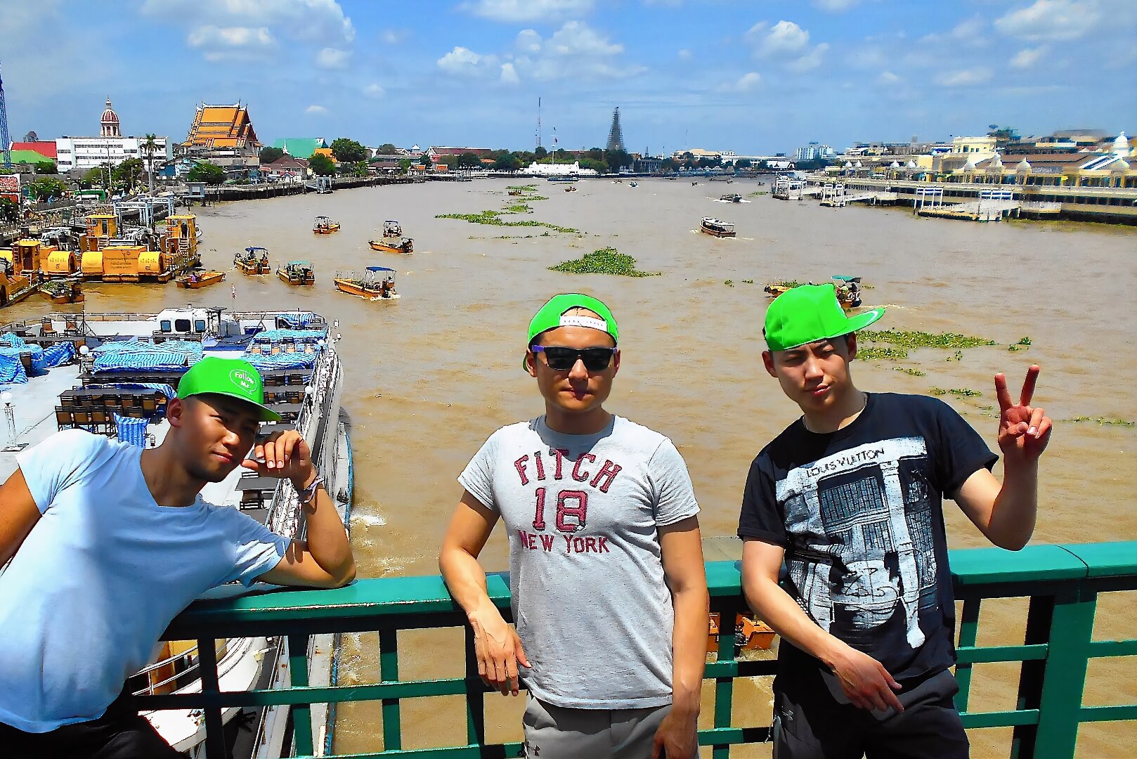 Guests standing on Memorial Bridge overlooking the Chao Phraya River in Bangkok