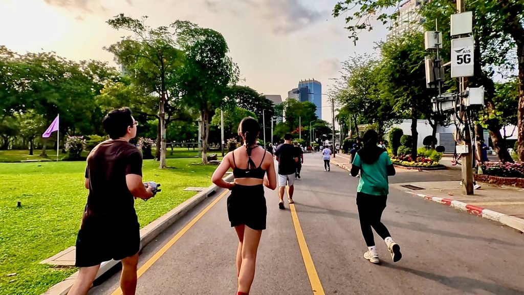 Lumphini Park outer path jogging activity Bangkok morning