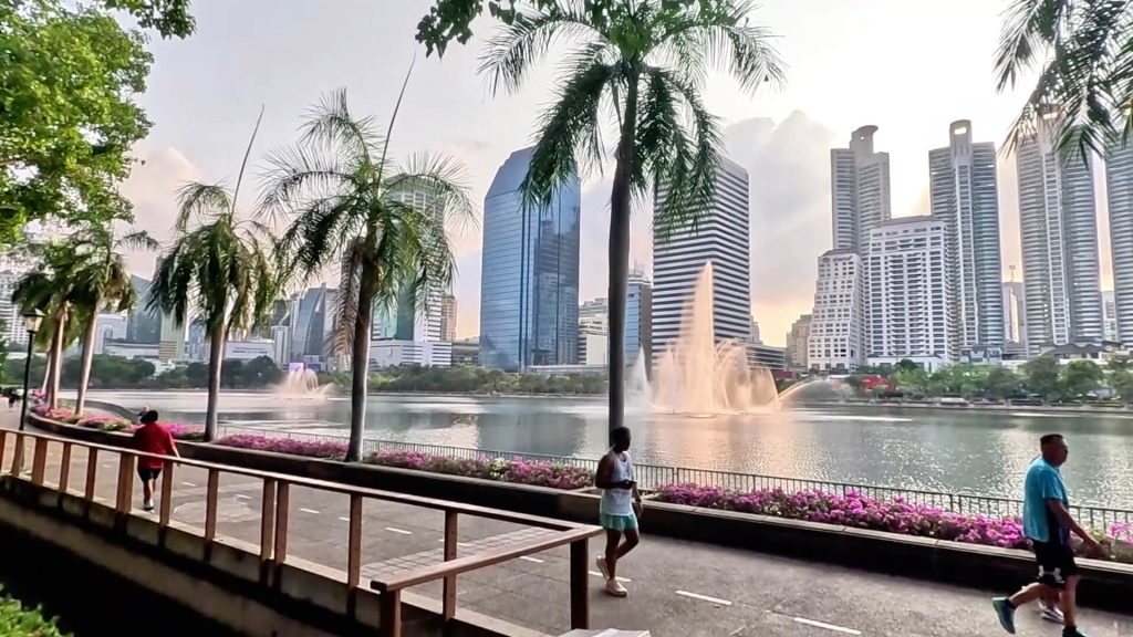 Skyline views across the lake at Benchakitti Park in Bangkok